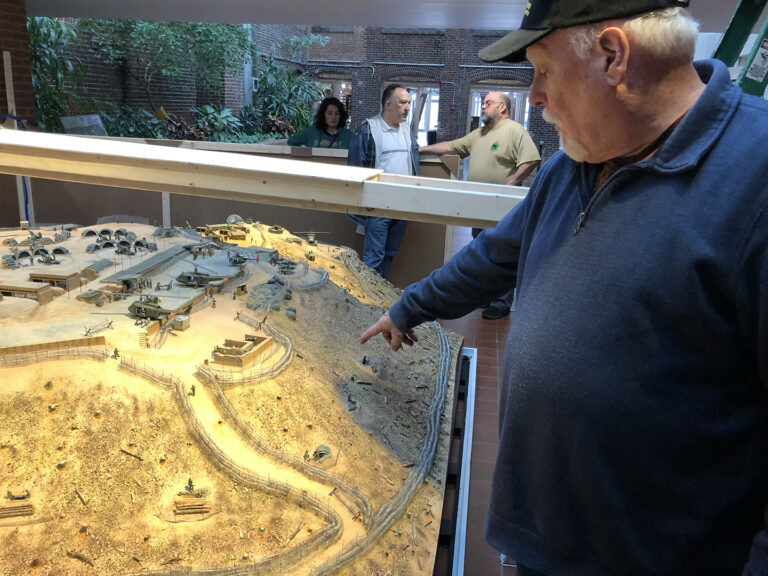 Craig Van Hout, pointing to where he was at a critical point during the battle image