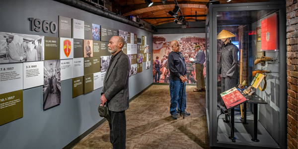 men observing the timeline entrance to the new exhibit